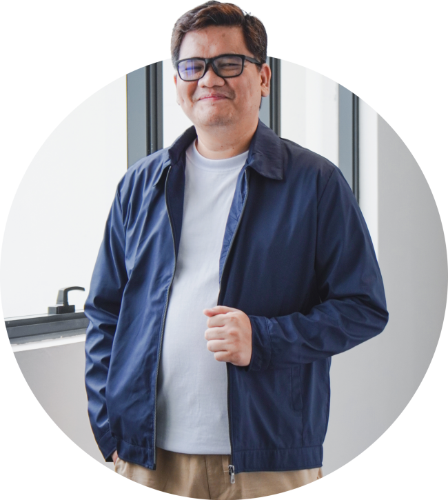 VizServe team member in business casual attire standing indoors and smiling