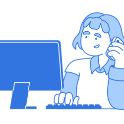 Woman working at computer and talking on phone